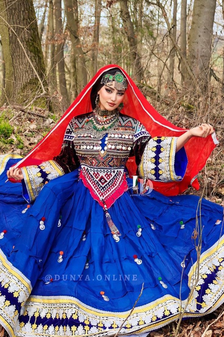 Sapphire Afghan Kuchi dress with geometric bodice and red veil