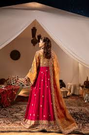 Burgundy Afghan evening look in a tented interior